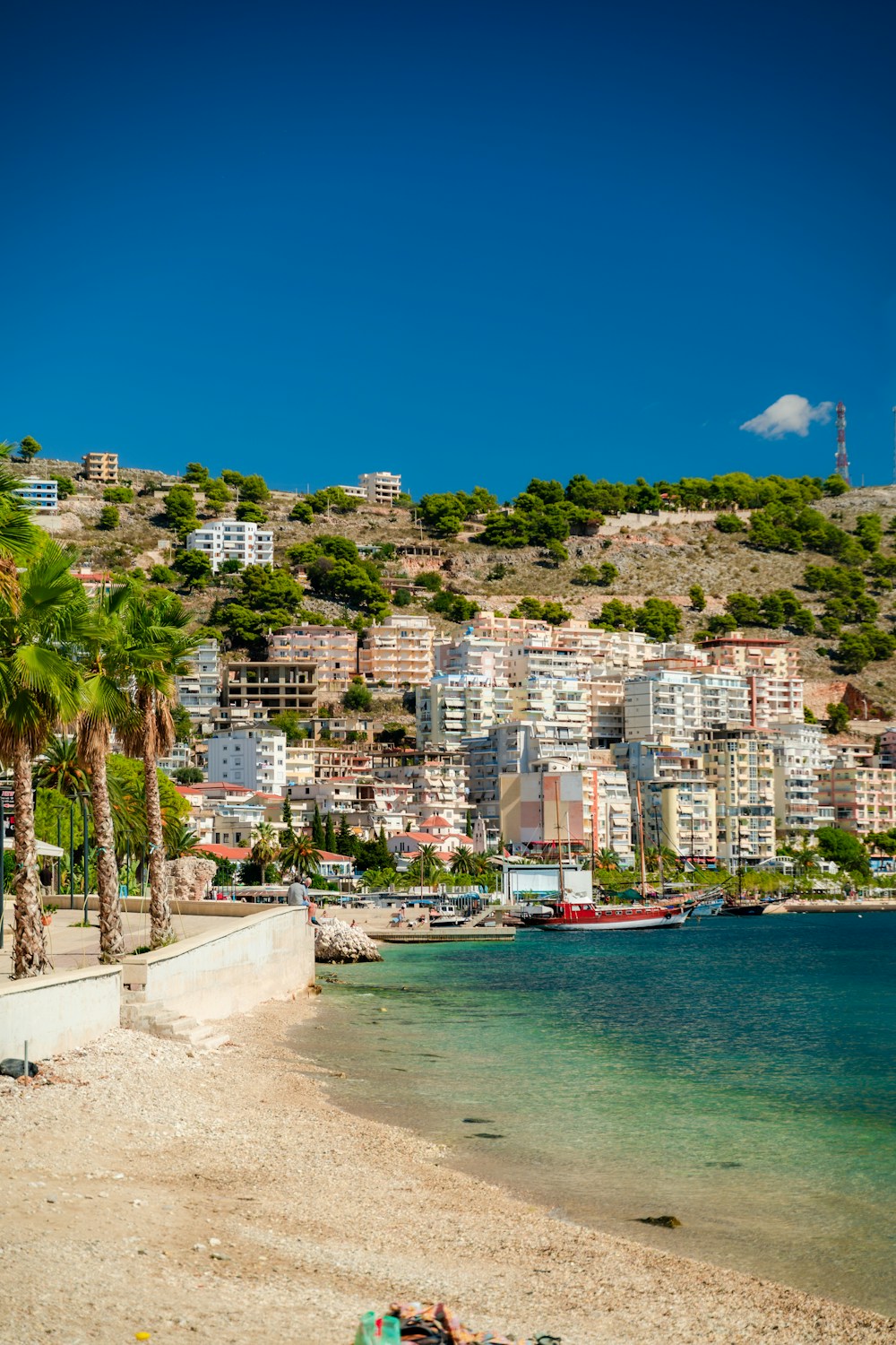 Coastal town in Albania with hills and blue sea